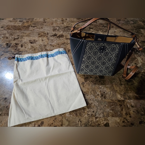 Handbags - Tory Burch Small McGraw Bucket Bag with a T Monogram pattern.